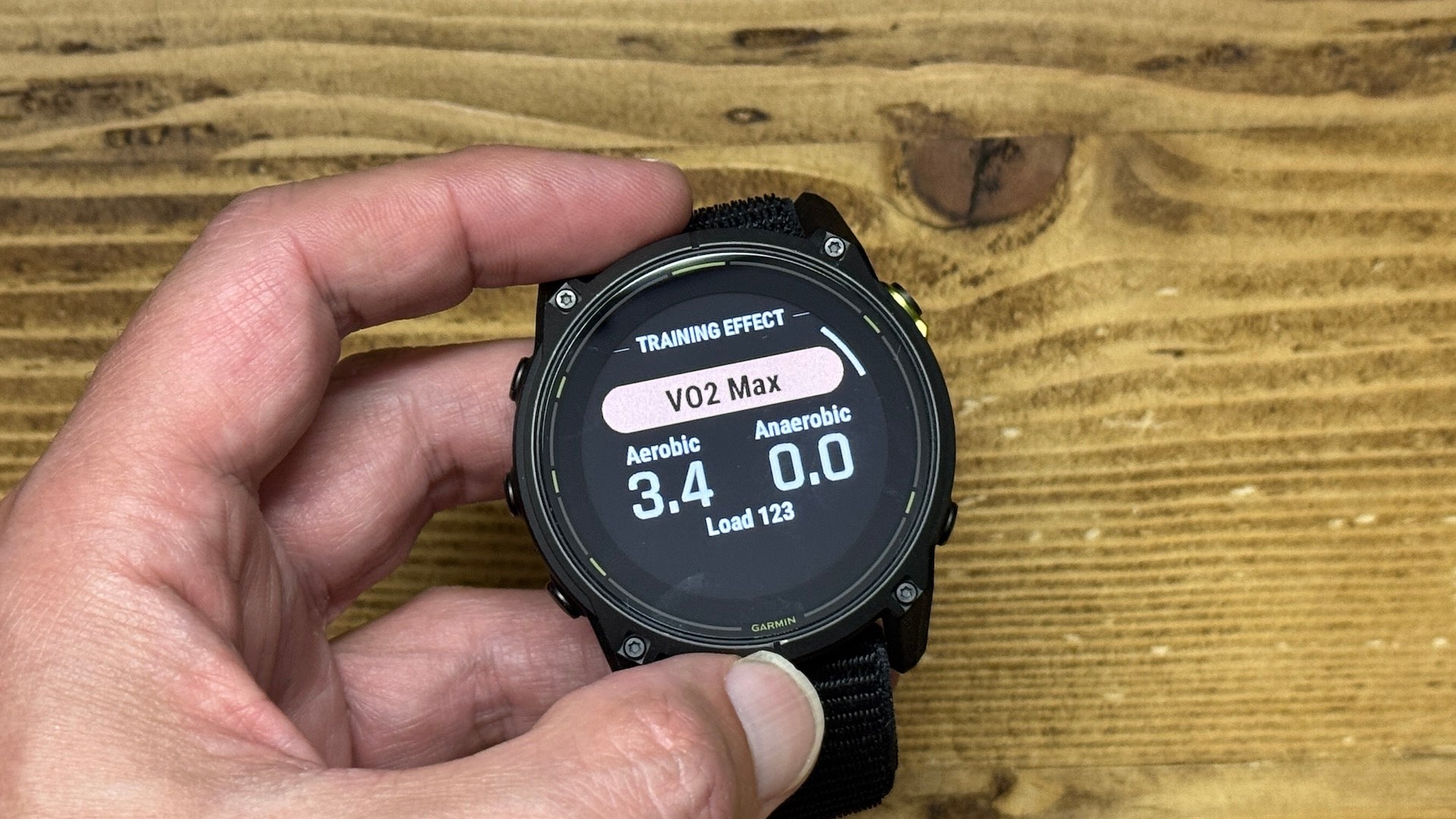 The Garmin Enduro 3 ultra watch held by reviewer Kieran Alger showing VO2 Max on display