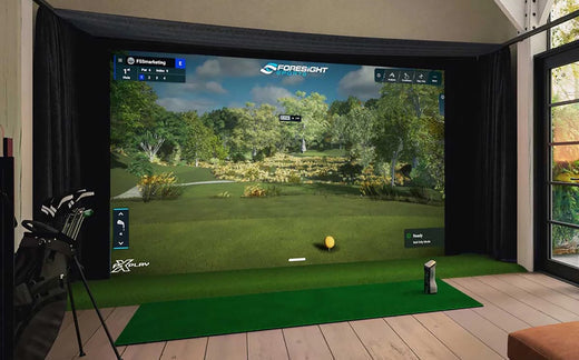 The GCQuad in a home golf simulator with Foresight Sports software on the screen