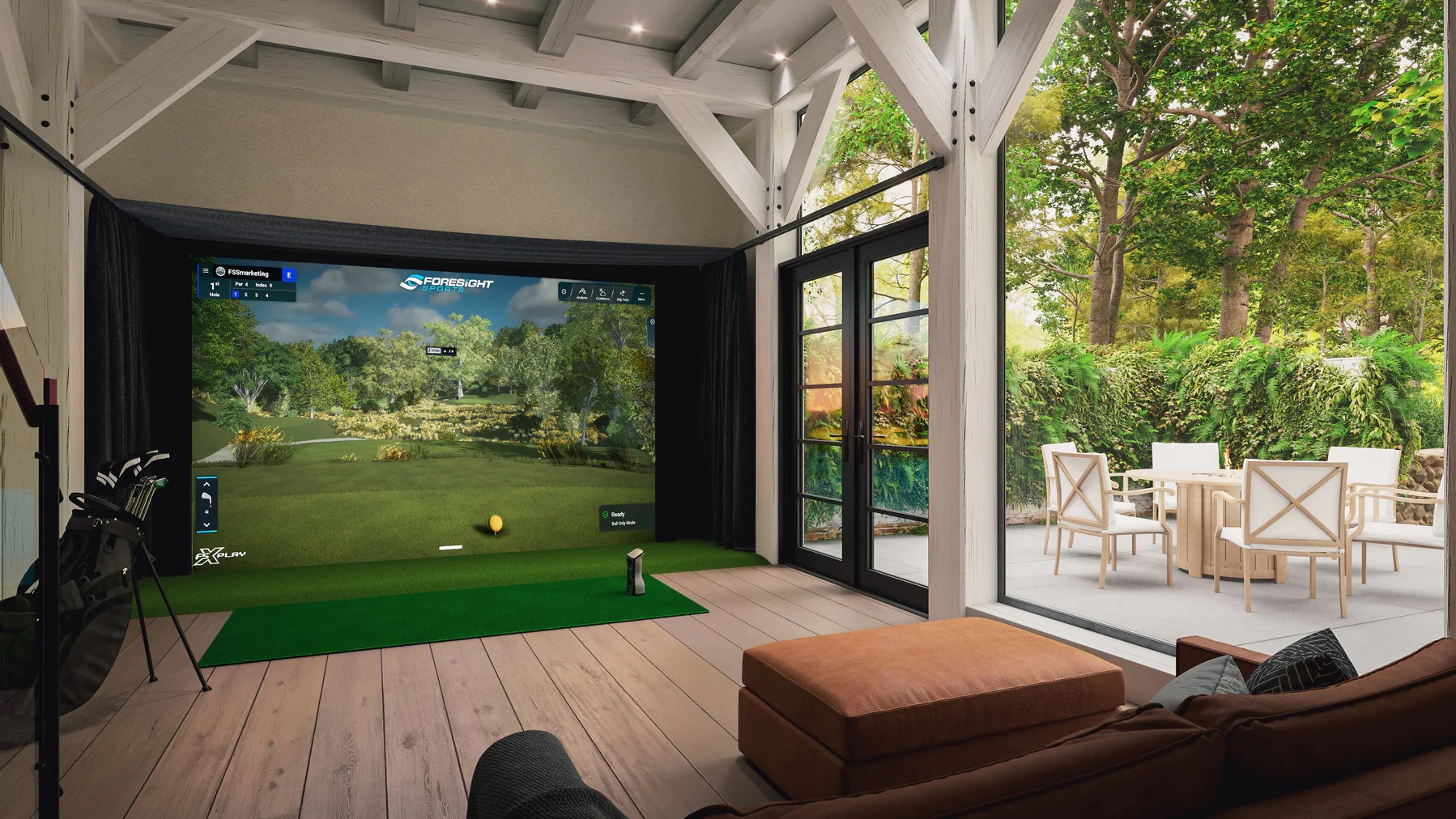 A home golf simulator on a back enclosed porch with a GCQuad and FSX golf software on the impact screen