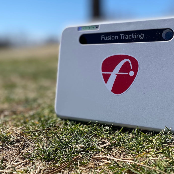 The FlightScope Mevo Plus golf launch monitor sitting on the golf course