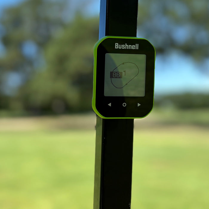 Green Bushnell Phantom 3 GPS handhelds stuck by the magnetic mount to golf reviewer Marc's golf cart at the course