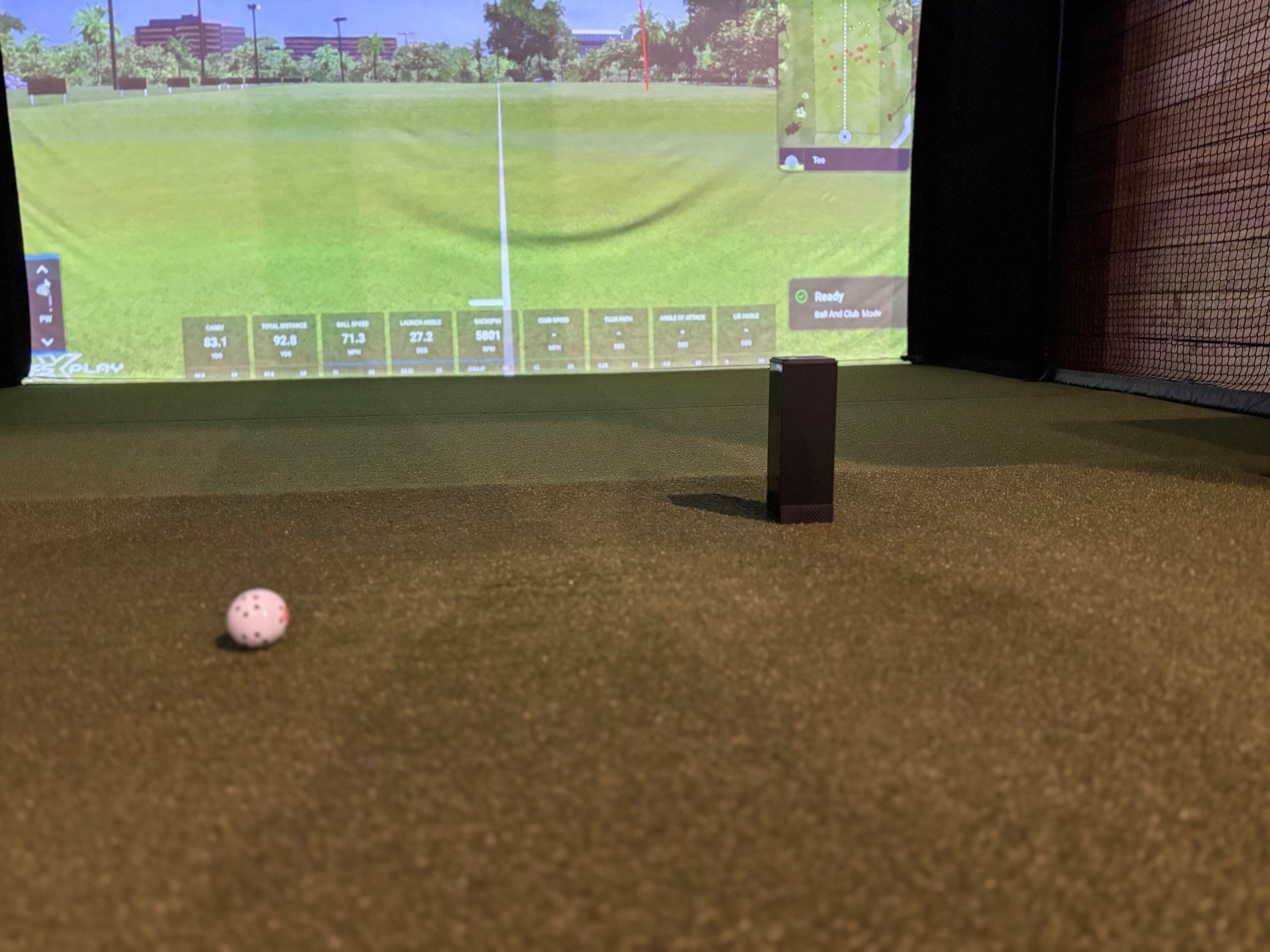 The Square Golf Indoor Launch Monitor in an indoor golf simulato