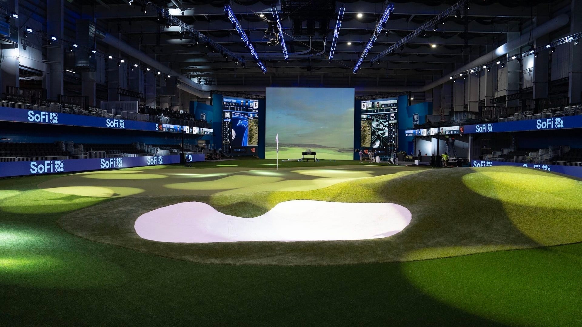 The TGL arena with giant screen and indoor tees, greens and sand bunkers