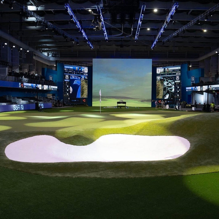 The TGL arena with giant screen and indoor tees, greens and sand bunkers