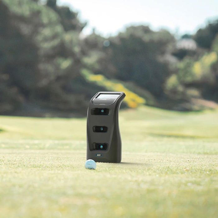 The Foresight Sports GC3 on a golf course with a golf ball in front of it