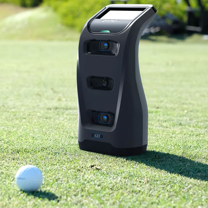 Closeup of a Foresight Sports GC3 golf launch monitor on the golf course with a golf ball in front of it