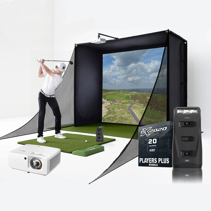 A golfer swinging at a golf ball on a golf mat in front of a Foresight Sports GC3 launch monitor with a projector, GC3 unit and FSX 2020 Players Plus package in the foreground